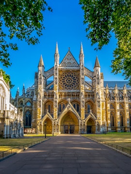 Westminster Abbey exterior with tourists in London.