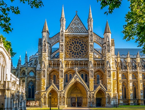Westminster Abbey exterior with tourists in London.
