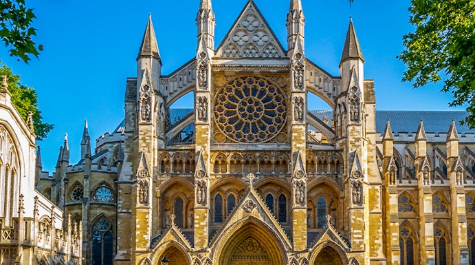 Westminster Abbey exterior with tourists in London.