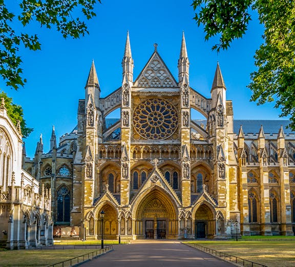 Westminster Abbey exterior with tourists in London.