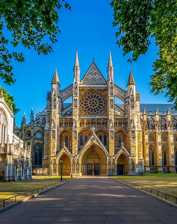 Westminster Abbey exterior with tourists in London.