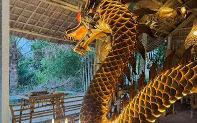 Bamboo dragon sculpture in Hoi An workshop showcasing local craft and sustainability.