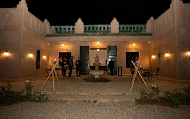 Courtyard of a traditional Moroccan building at night, Marrakech tour.