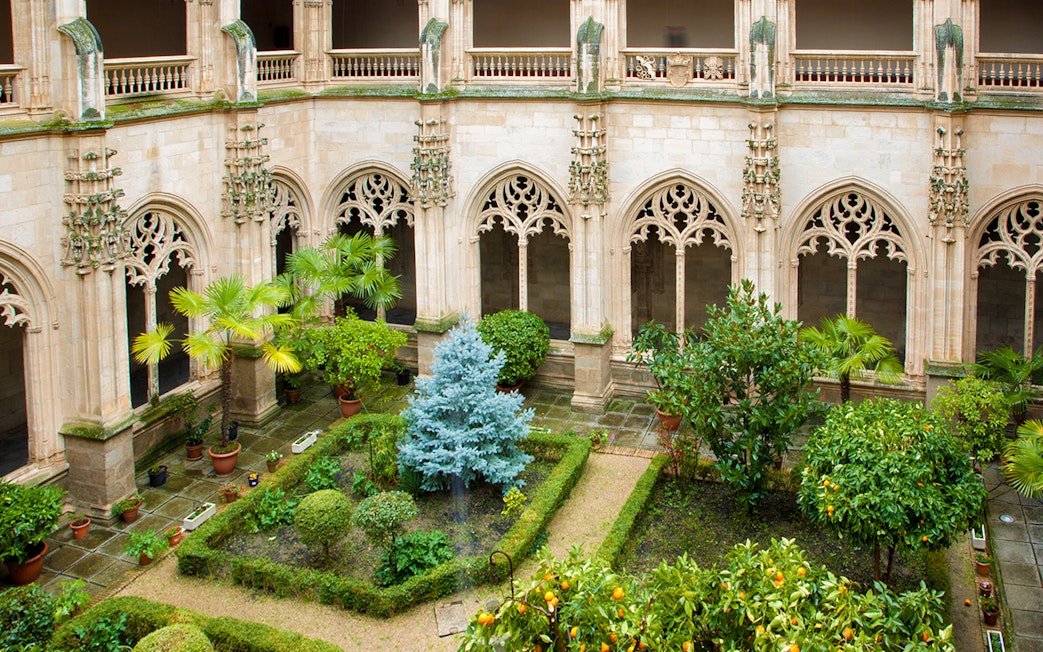 Gothic atrium garden with arches at Monasterio San Juan de los Reyes, Toledo.