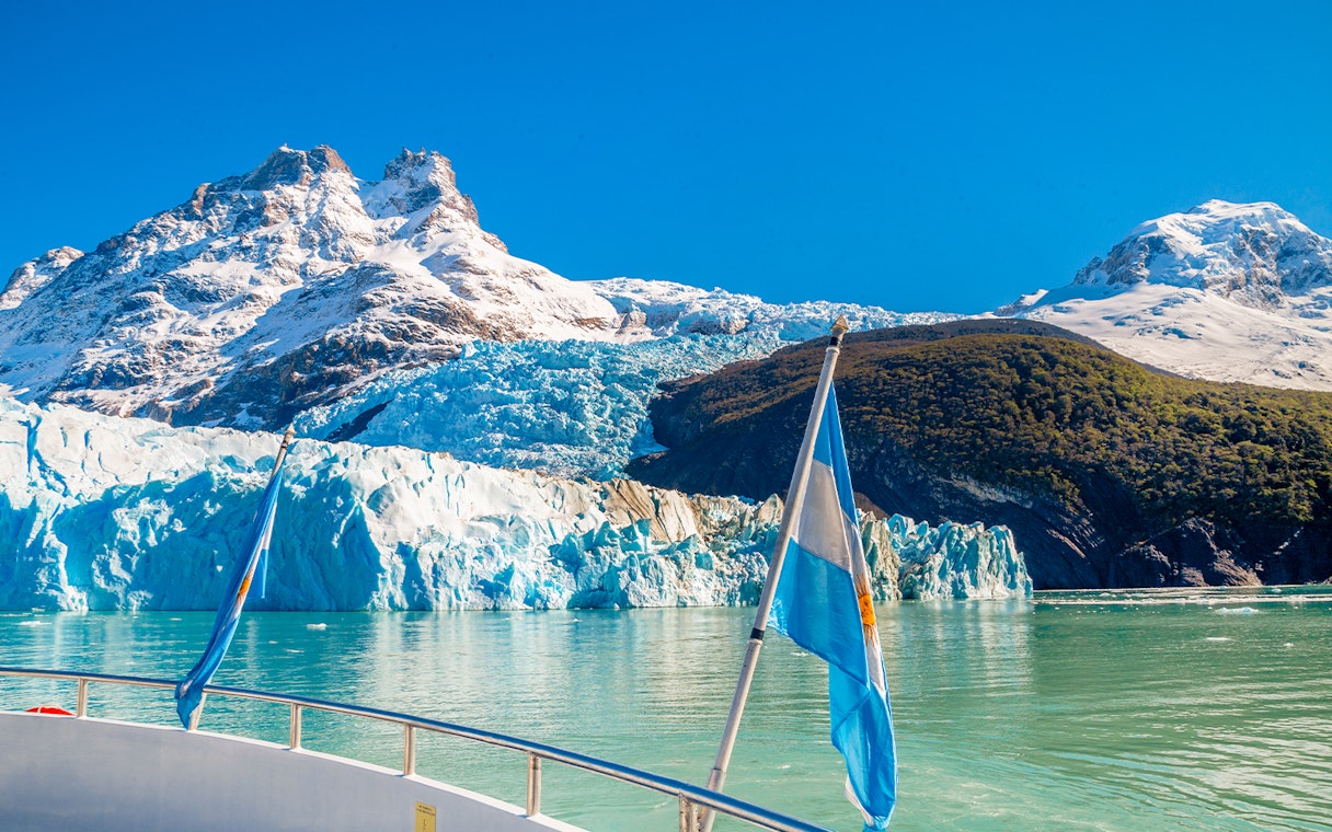 Boat view of Spegazzini Glacier with snow-capped mountains in Los Glaciares National Park, Argentina.