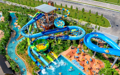 Aerial view of water slides and lazy river at SplashMania Waterpark, Gamuda Cove, Selangor.