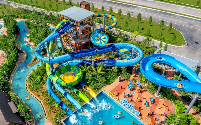 Aerial view of water slides and lazy river at SplashMania Waterpark, Gamuda Cove, Selangor.
