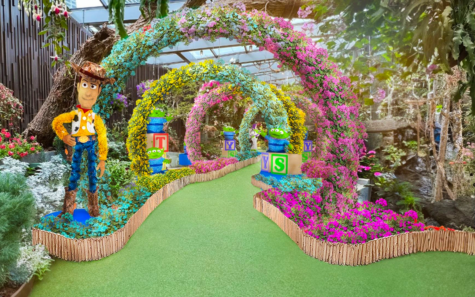 Colorful floral arches with character sculptures at Gardens by the Bay's Floral Fantasy, Singapore.
