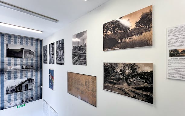 Exhibit of historical photos and documents at Auschwitz Sub-Camps tour.