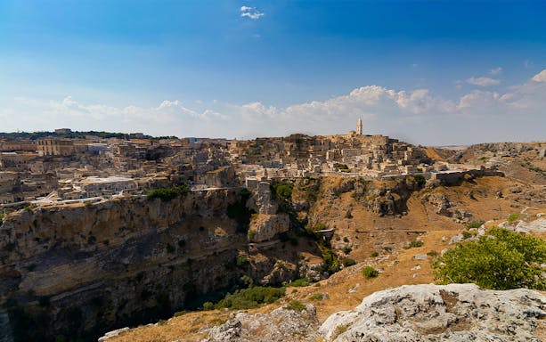 Ancient cityscape of Matera with rocky cliffs in Parco Regionale della Murgia Materana.