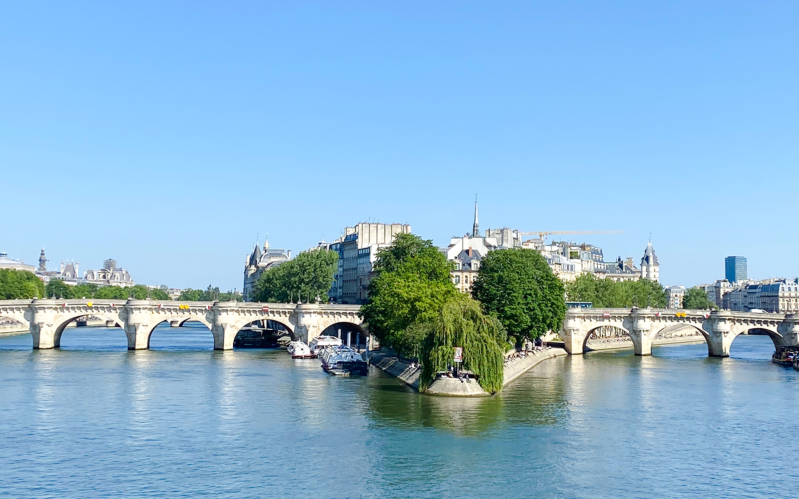 Seine River view with Pont Neuf bridge in Paris, part of the Treasure Hunt tour.
