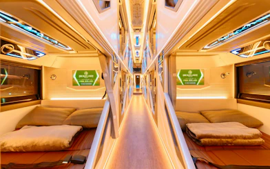 Sleeper cabin interior of shared shuttle from Sapa to Hanoi Noi Bai Airport.