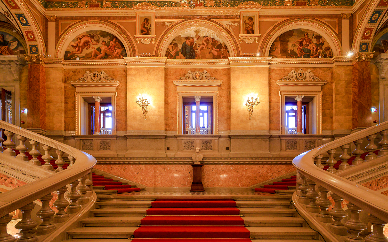 Grand staircase and ornate hallway inside the Hungarian State Opera, Budapest.