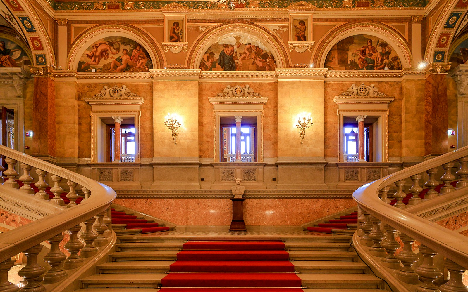 Grand staircase and ornate hallway inside the Hungarian State Opera, Budapest.