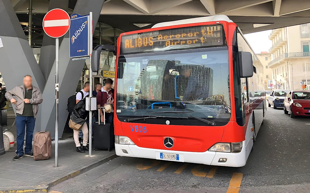 Alibus at Naples Capodichino Airport for transfer to Naples Maritime Station.