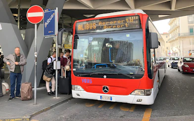 Alibus at Naples Capodichino Airport for transfer to Naples Maritime Station.