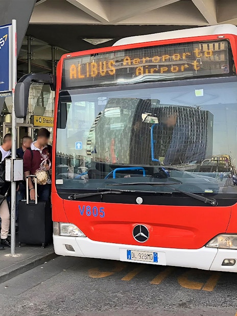 Alibus at Naples Capodichino Airport for transfer to Naples Maritime Station.