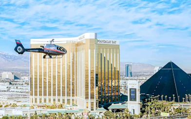Helicopter flying near Mandalay Bay and Luxor Hotel in Las Vegas during Red Rock Canyon tour.