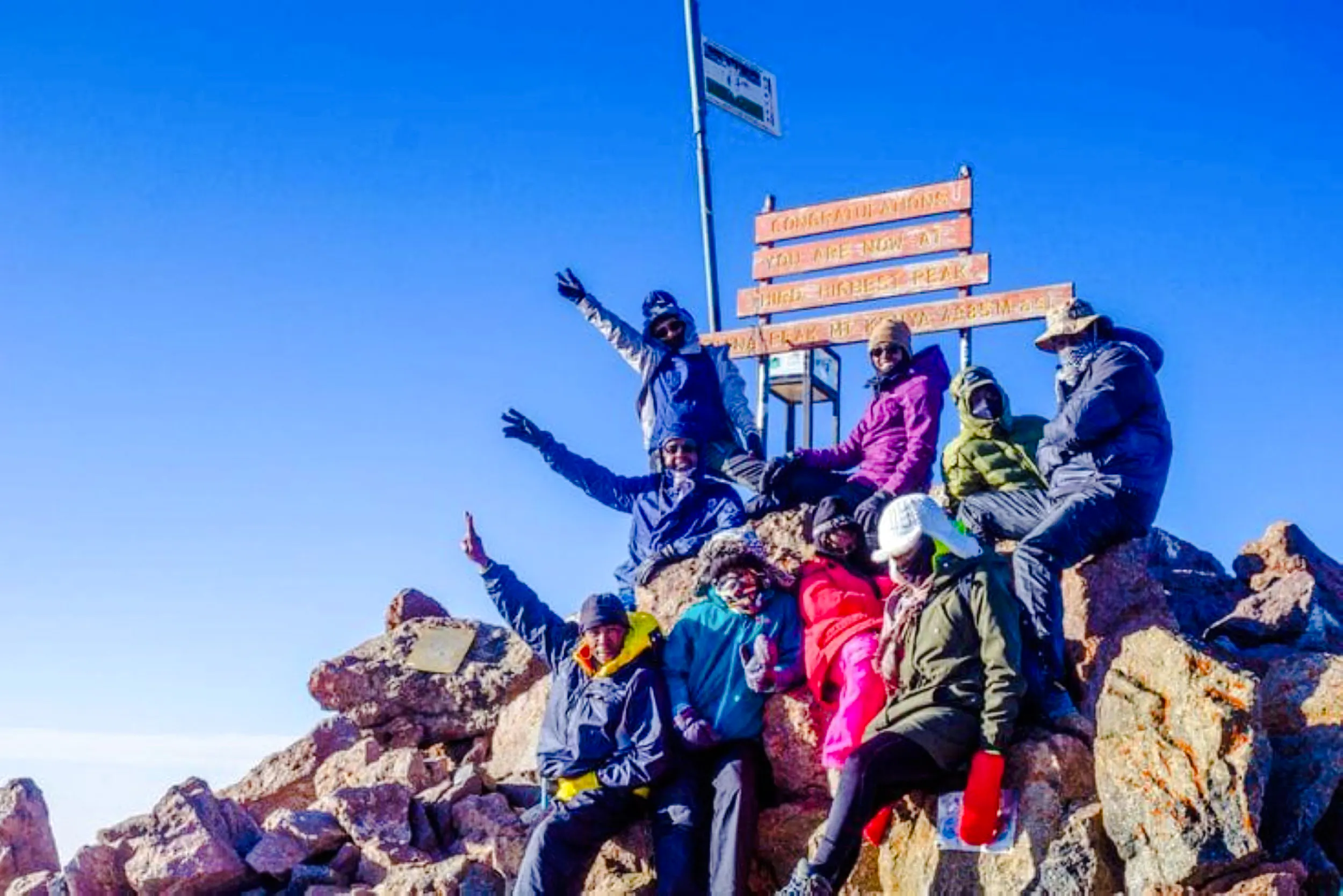Group of hikers at the summit of Mt Kenya during a day tour from Nairobi.