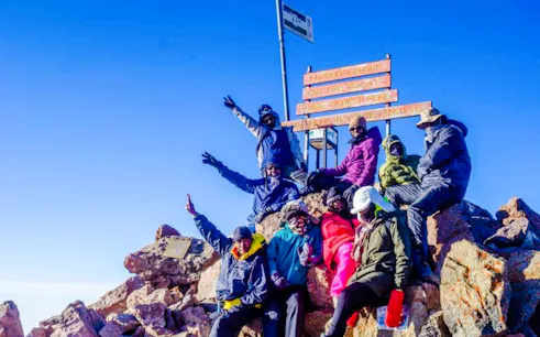 Group of hikers at the summit of Mt Kenya during a day tour from Nairobi.