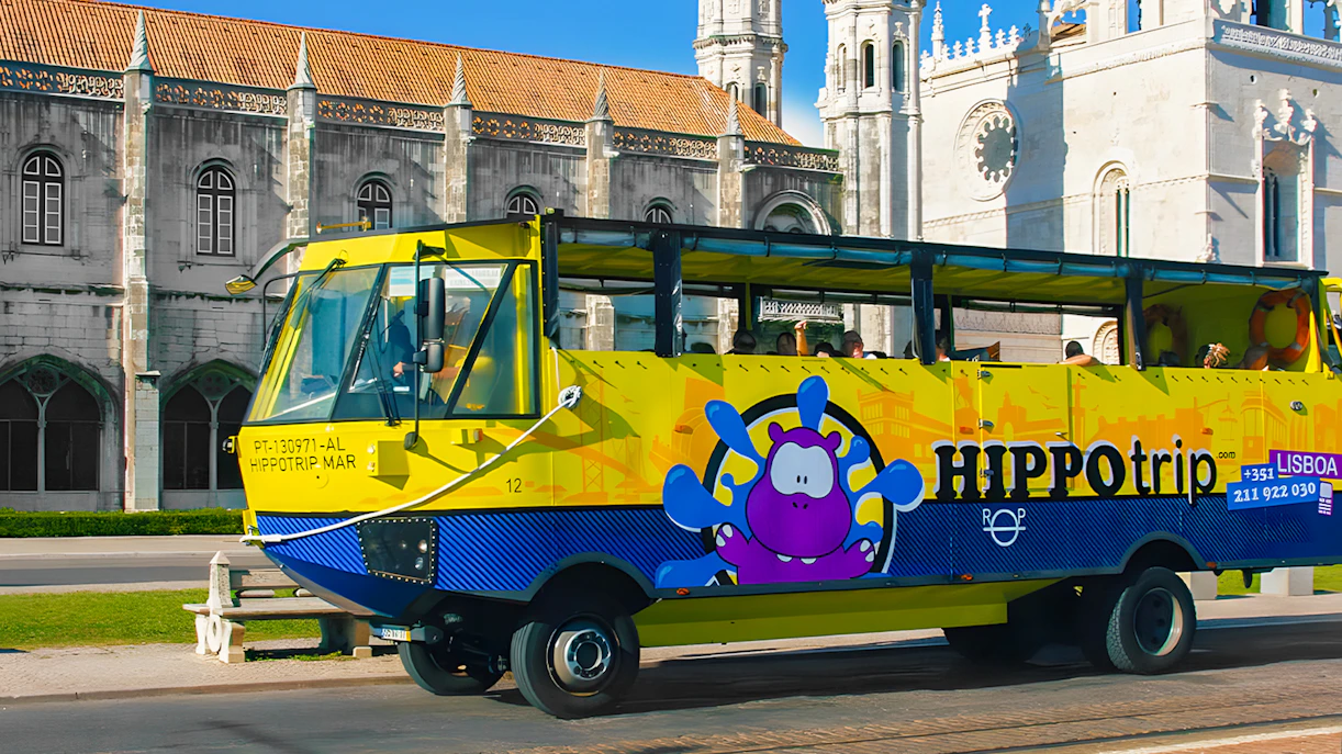 HIPPOtrip vehicle driving past Jerónimos Monastery in Lisbon.