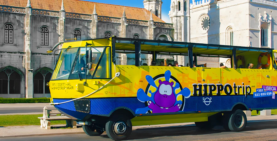 HIPPOtrip vehicle driving past Jerónimos Monastery in Lisbon.
