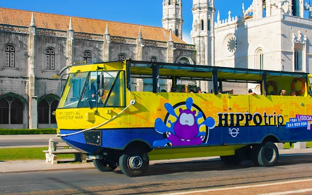 HIPPOtrip vehicle driving past Jerónimos Monastery in Lisbon.