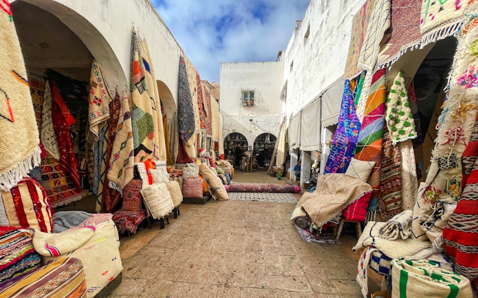Moroccan handicraft shops under arches on Rue Ibn Khaldoun, Habaus district medina.