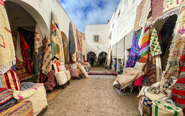 Moroccan handicraft shops under arches on Rue Ibn Khaldoun, Habaus district medina.