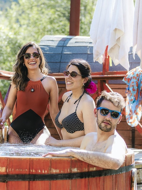 People relaxing in a hot tub at Santuario del Río Spa.