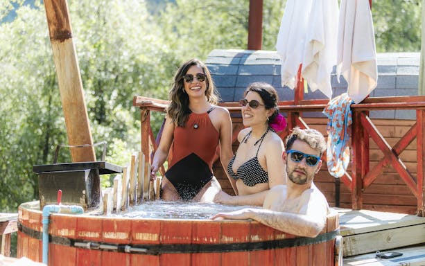 People relaxing in a hot tub at Santuario del Río Spa.