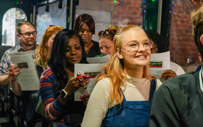 Passengers enjoying Old Town Trolley's Holiday Sights and Festive Nights Tour in Savannah.