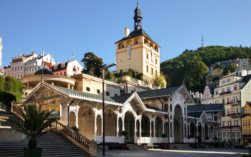 Market Colonnade and Castle Tower in Karlovy Vary, Czech Republic, with ornate architecture.