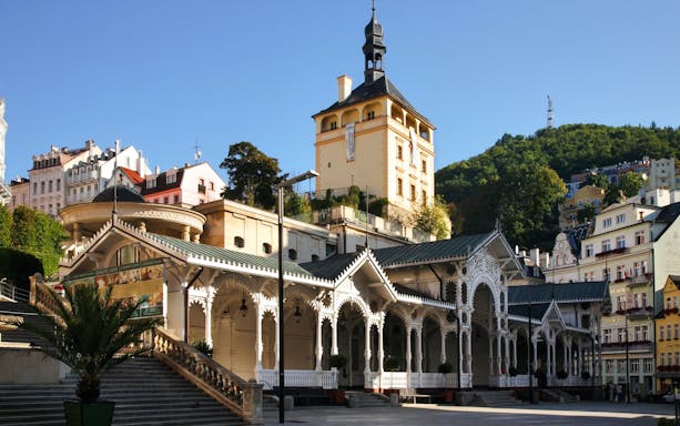 Market Colonnade and Castle Tower in Karlovy Vary, Czech Republic, with ornate architecture.