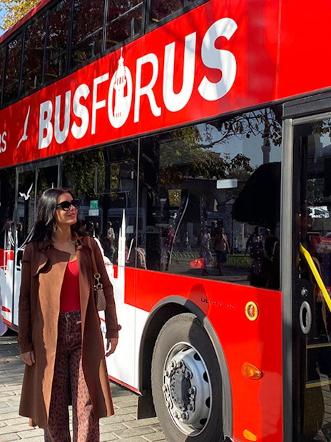 Hop-on hop-off bus tour in Istanbul with passengers boarding.