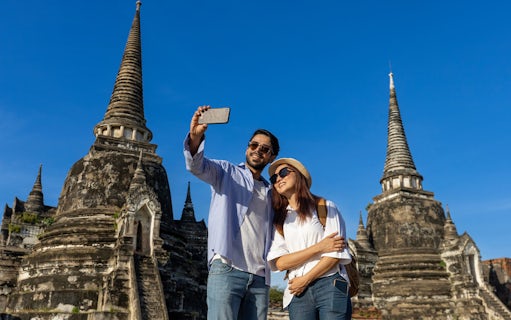 Tourists taking a selfie at Wat Phra Si Sanphet, Ayutthaya, Thailand.