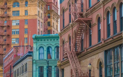Historic buildings with fire escapes in Vancouver's Gastown district.