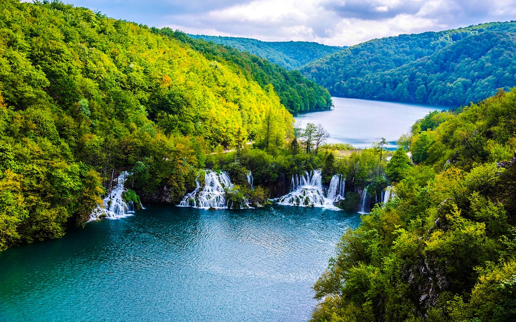 Plitvice Lakes waterfalls and lush forest view during private day tour from Split.