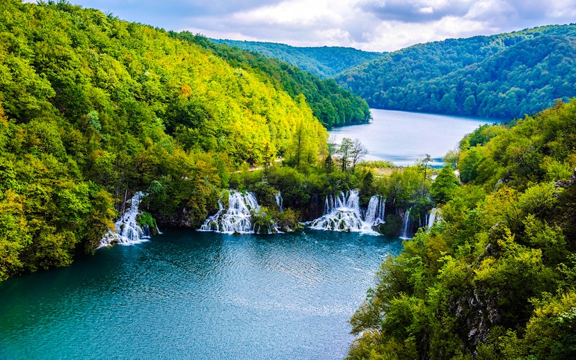 Plitvice Lakes waterfalls and lush forest view during private day tour from Split.