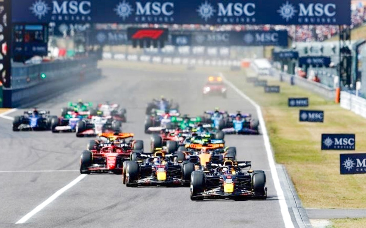 F1 cars racing at the Japanese Grand Prix 2025 in Suzuka, Japan.