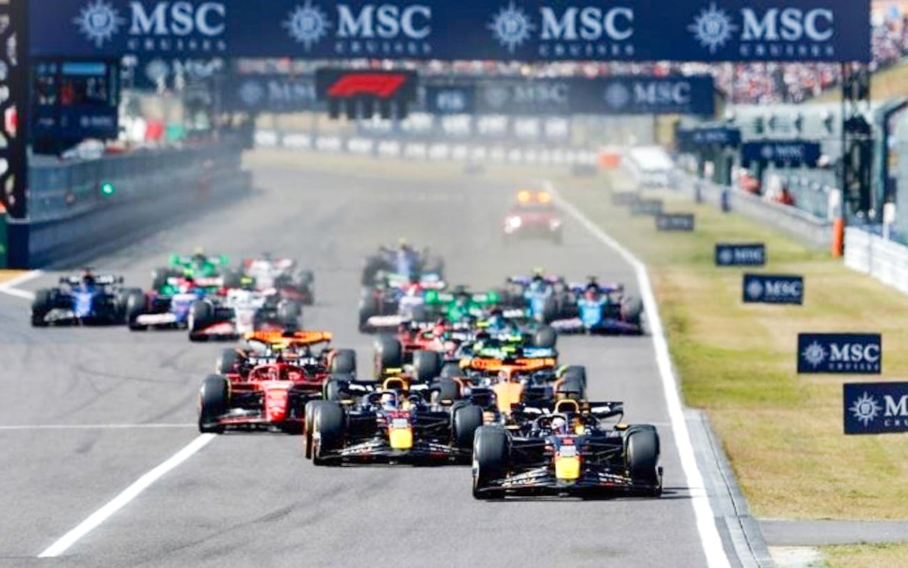 F1 cars racing at the Japanese Grand Prix 2025 in Suzuka, Japan.