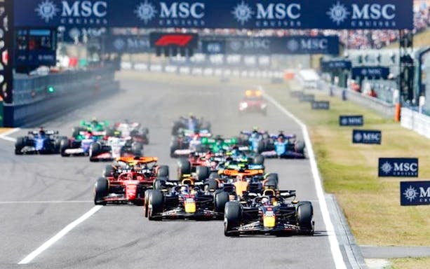 F1 cars racing at the Japanese Grand Prix 2025 in Suzuka, Japan.