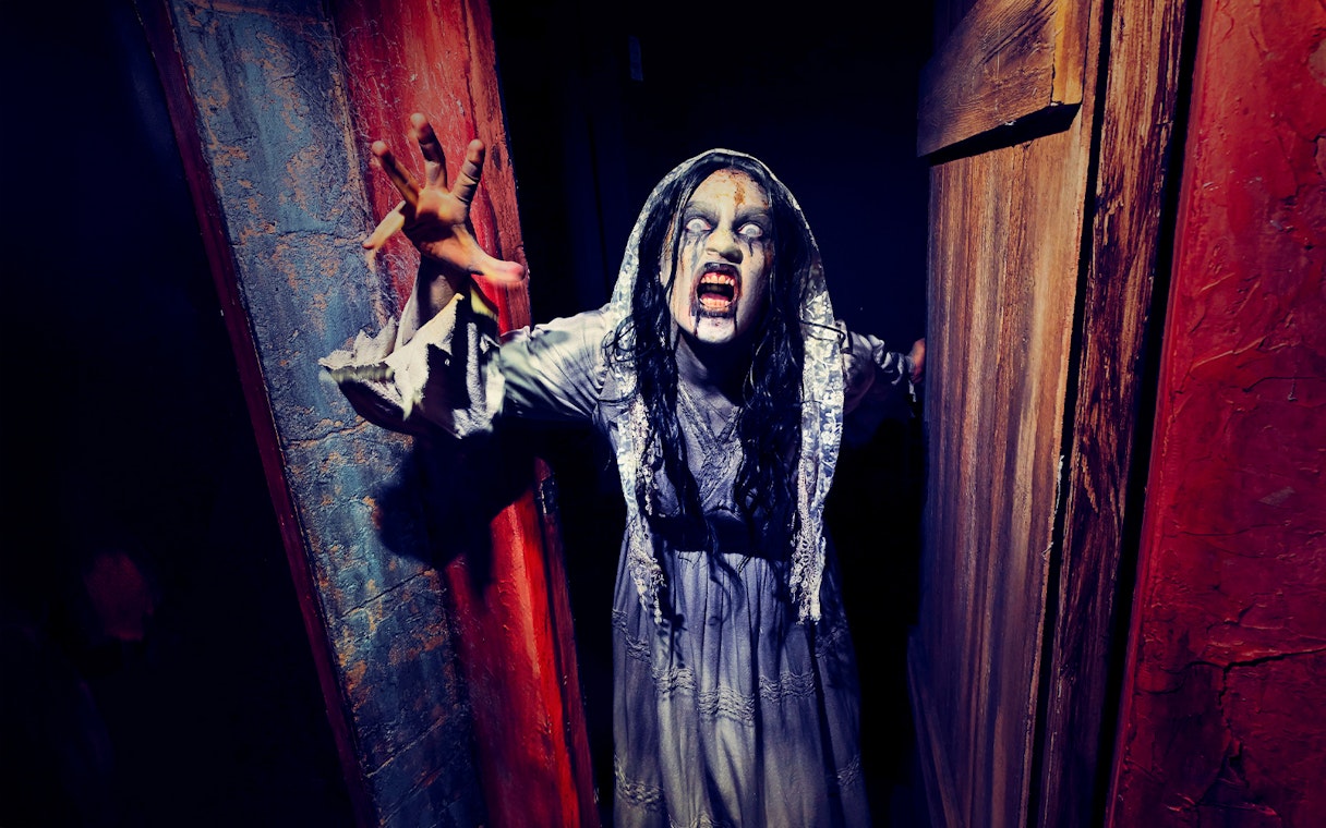 Ghost bride reaching out at Hollywood Horror Nights, Universal Studios Hollywood, Los Angeles.