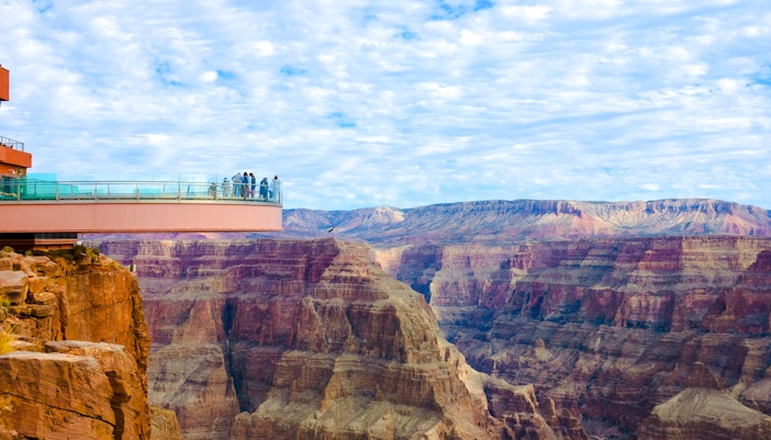 Visitors on the Skywalk glass bridge overlooking the Grand Canyon.