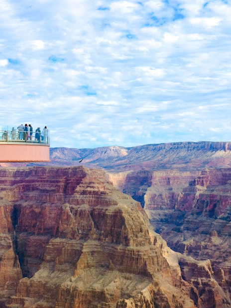 Visitors on the Skywalk glass bridge overlooking the Grand Canyon.