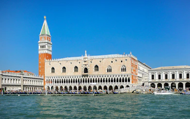 Doge's Palace and St. Mark's Campanile viewed from the Grand Canal in Venice.