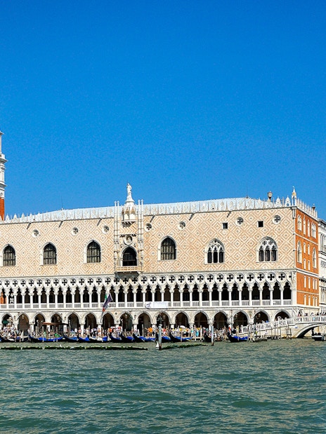 Doge's Palace and St. Mark's Campanile viewed from the Grand Canal in Venice.
