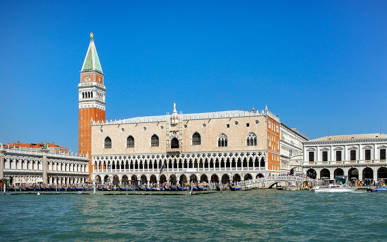 Doge's Palace and St. Mark's Campanile viewed from the Grand Canal in Venice.