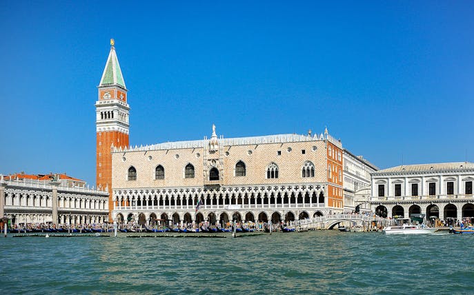 Doge's Palace and St. Mark's Campanile viewed from the Grand Canal in Venice.