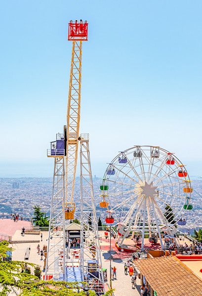 Tibidabo amusement park rides overlooking Barcelona, Spain.